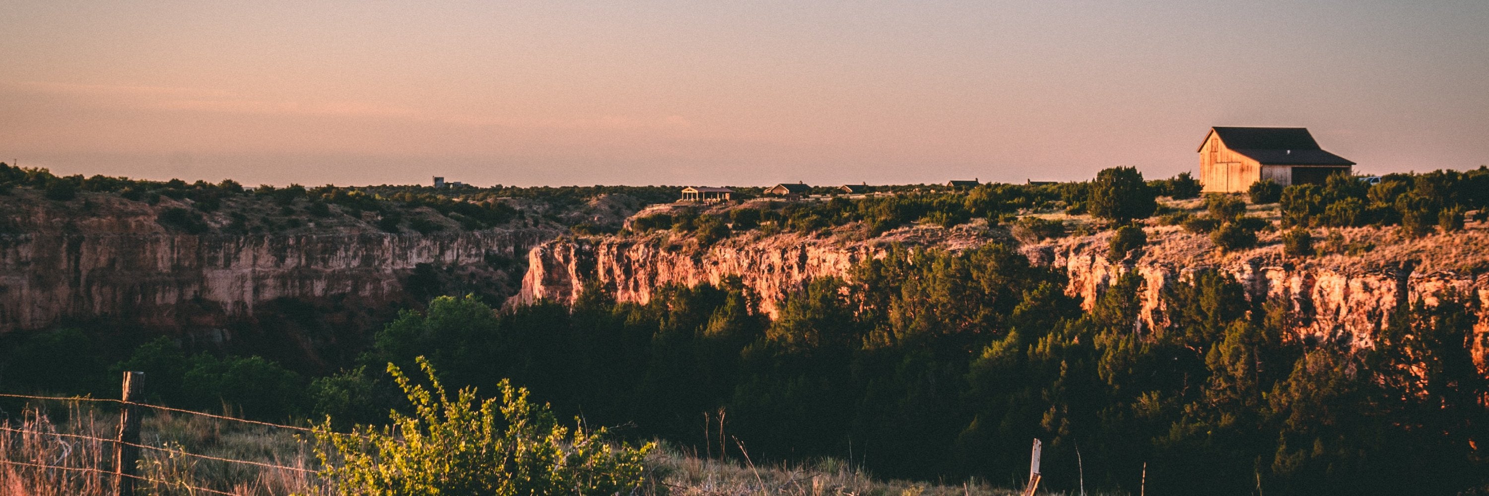 Photo of Palo Duro Canyon during golden hour taken by Matthew Lancaster, 2020. Smells like red clay, palo santo, dry grass, and terracotta amber.