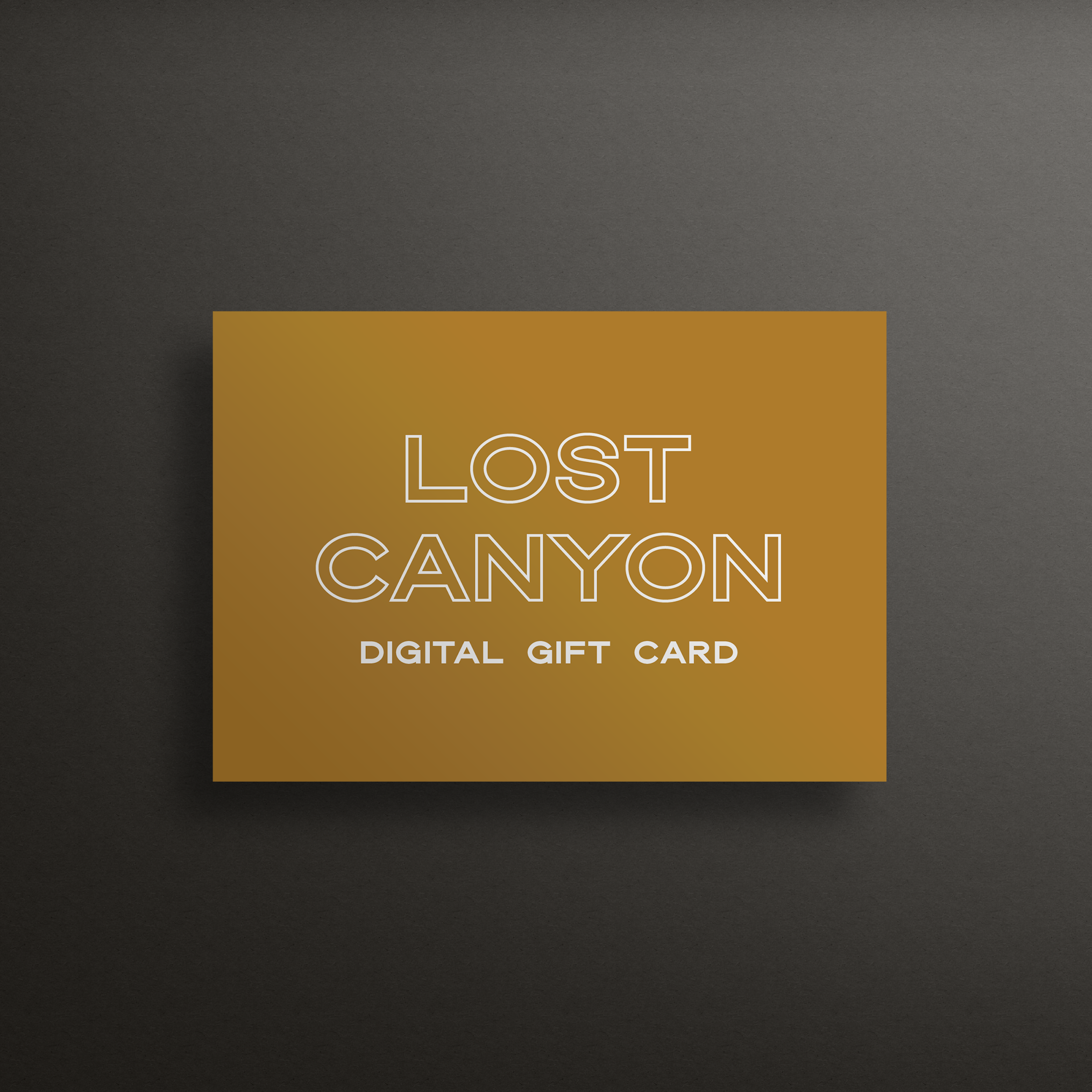 An image of a yellow square floating over a dark gray background. On the yellow square are the words "Lost Canyon - Digital Gift Cards"